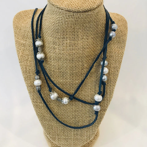 Deep blue suede cord strung with grey and white freshwater pearls with silver accents